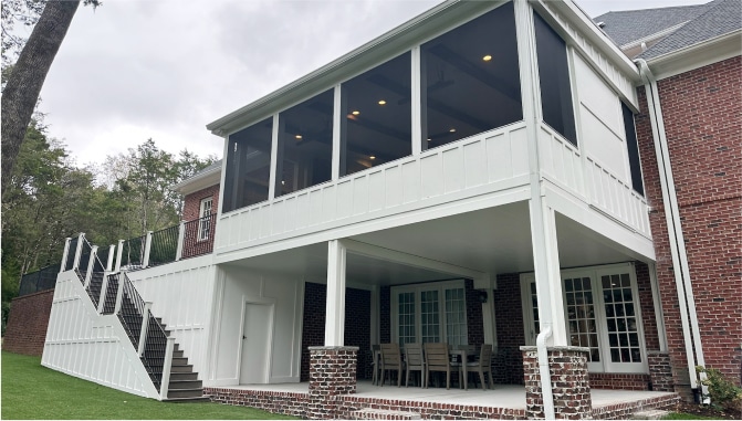 elevated-deck-with-screened-in-porch-on-the-brick-house-with-outdoor-living-dining-set-area-below-in-franklin-tn